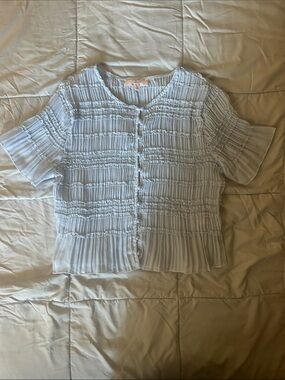 Light blue smocked button front top